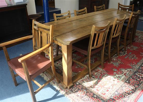 A 17th century style oak plank topped refectory table and eight oak dining chairs, by Derek Hyatt 243 x 82cm